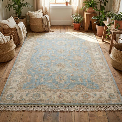 Traditional Oushak style rug with pale blue field and ivory floral motifs