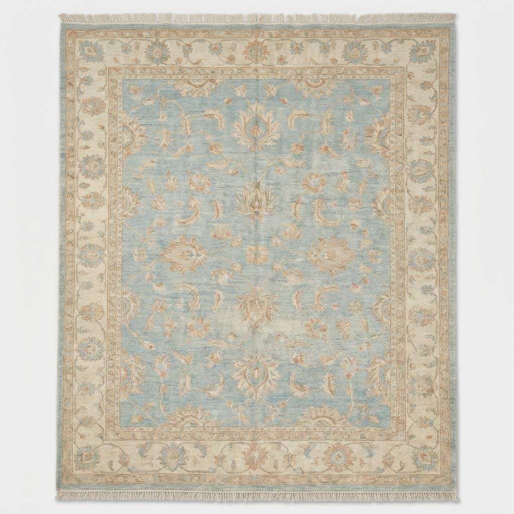 Artisan hand knotted wool rug styled in living room with hardwood flooring