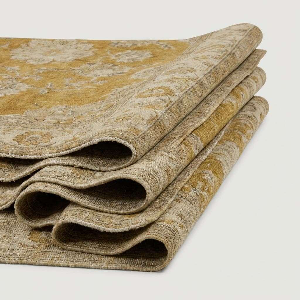Oushak hand-knotted wool rug with mustard floral design in cozy living room setting