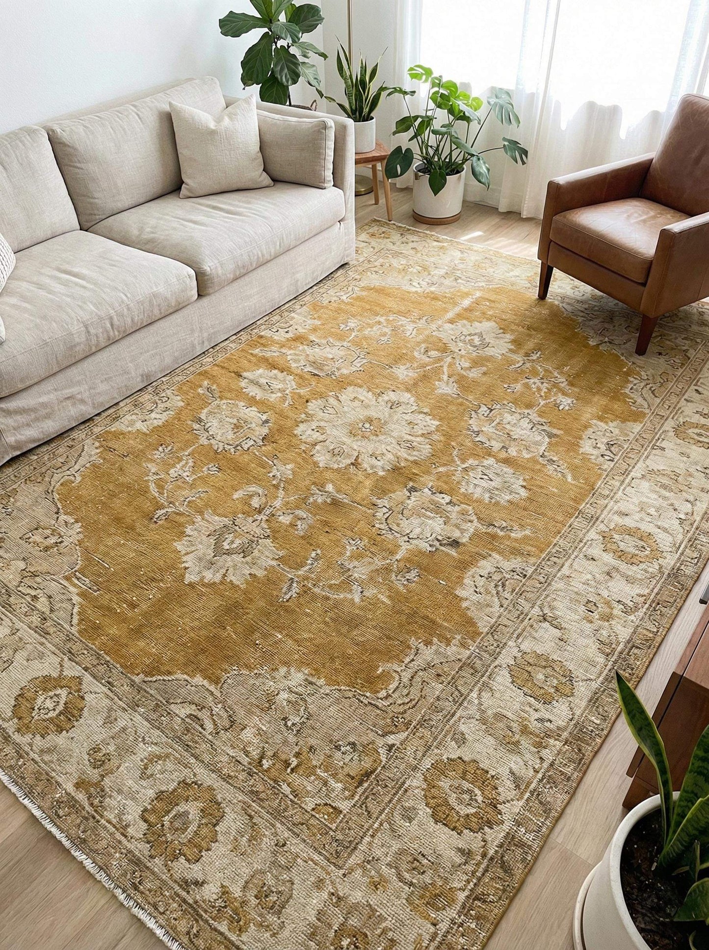 Oushak hand knotted wool rug with mustard floral design showcasing traditional craftsmanship and vintage style.