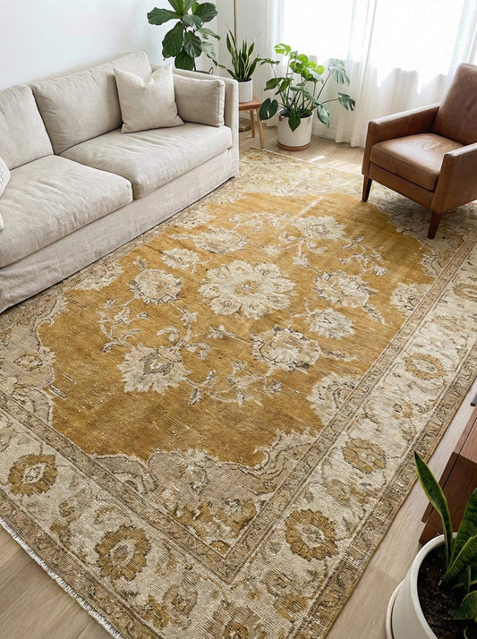 Oushak hand knotted wool rug with mustard floral design showcasing traditional craftsmanship and vintage style.