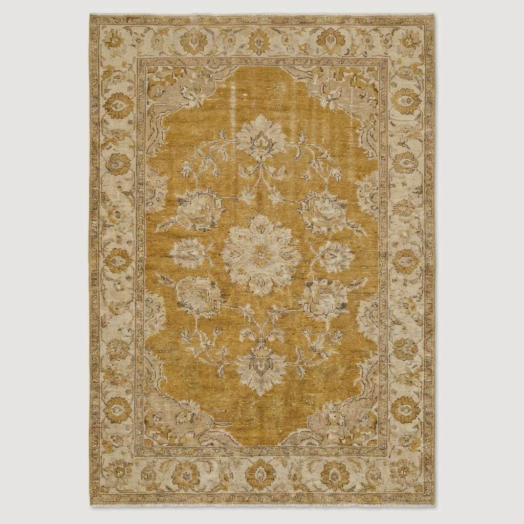 Oushak hand knotted wool rug with mustard floral design in living room setting