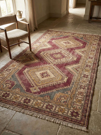 Oushak style hand knotted wool rug with geometric medallions and traditional Anatolian design