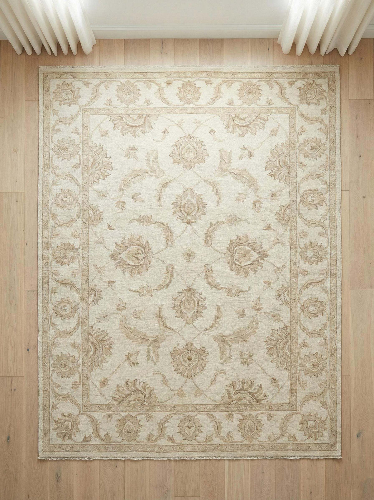 Hand-knotted Oushak style wool area rug with neutral floral design and soft wool pile for durable, elegant home decor
