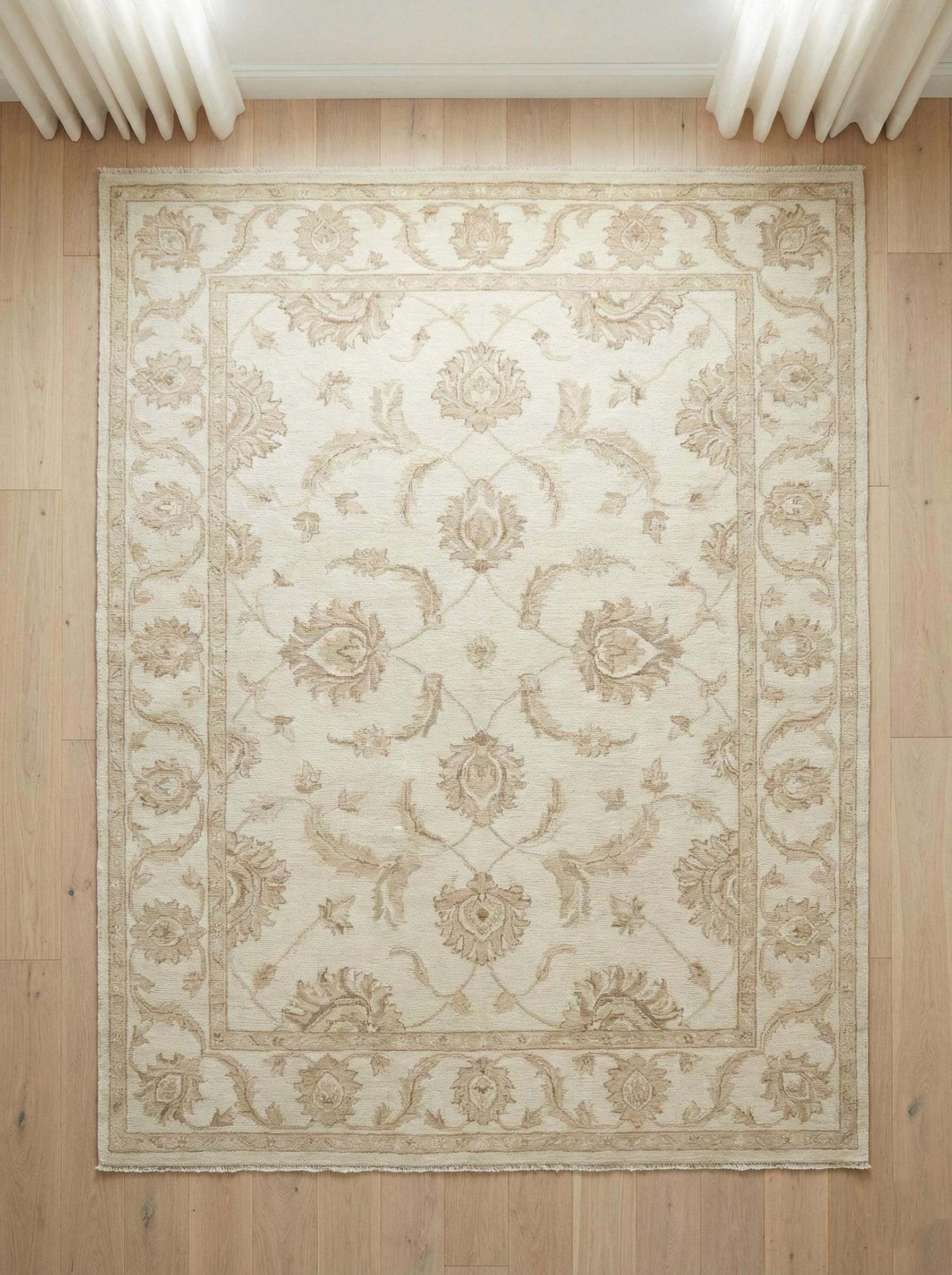 Hand-knotted Oushak style wool area rug with neutral floral design and soft wool pile for durable, elegant home decor