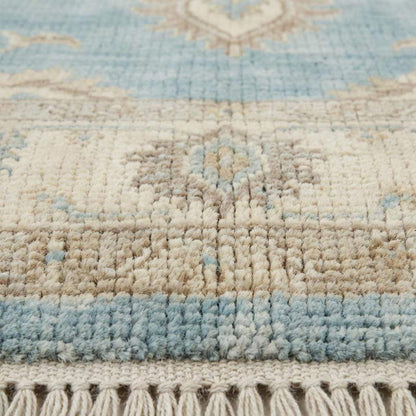 Close up of hand knotted wool pile showing dense knots, natural fibers, and soft texture
