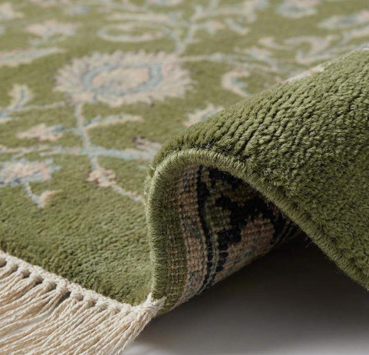 Close-up of hand knotted wool pile showing dense knots and soft natural fiber texture