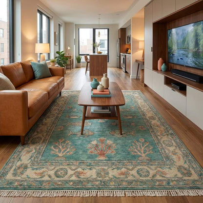 Artisan hand knotted area rug featuring coral and botanical motifs