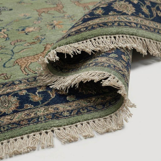 Close up of hand knotted wool pile showing detailed animal figures and knot texture