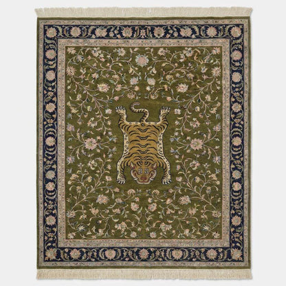 Traditional Persian tiger motif rug with navy floral border on wooden floor