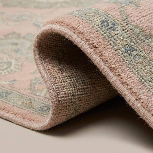 Close-up texture of hand knotted wool rug showing soft pile, detailed floral knots, and artisan weave structure __etsy:8005575633