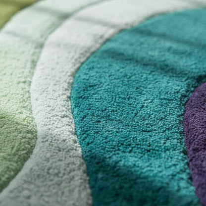 Hand tufted retro area rug with teal aqua geometric wave design, plush soft 70s style carpet