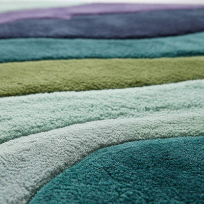Retro area rug with teal aqua geometric wave pattern, hand tufted plush soft 70s style carpet