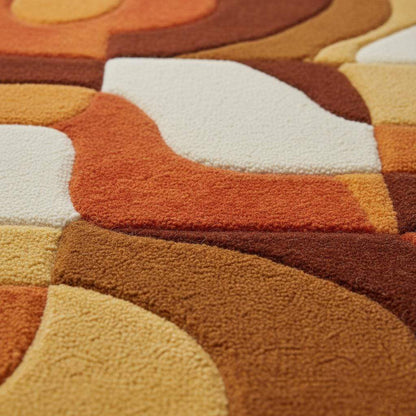 Retro rug with hand-tufted mustard orange geometric patterns and warm vintage tones