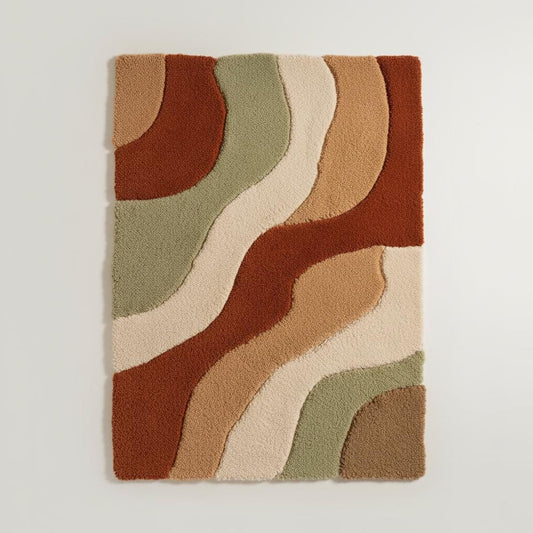 Hand-tufted wool rug with retro wavy desert wave design in terracotta, camel, cream, and sage tones for boho and mid-century decor.