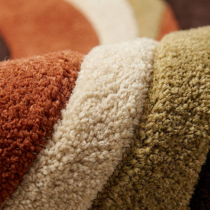 Hand-tufted retro rug with wavy burnt orange and brown abstract design for mid-century modern decor