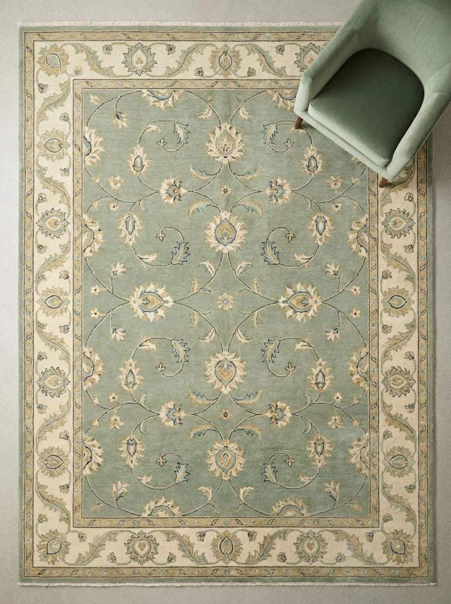 Sage green hand-knotted Oushak rug with muted floral motifs and authentic Turkish wool craftsmanship