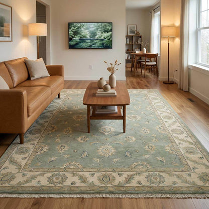 Sage green hand-knotted Oushak rug with muted floral motifs and fringe, authentic Turkish wool area carpet for living room decor