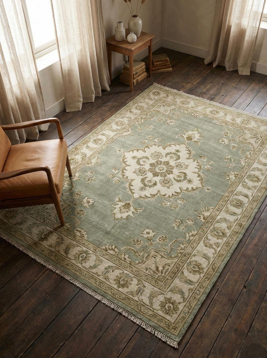 Hand knotted sage green Oushak wool rug with floral medallion design