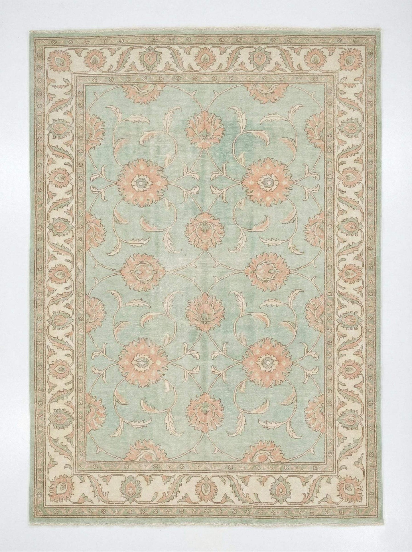 Hand knotted sage green Oushak wool rug with floral Turkish design