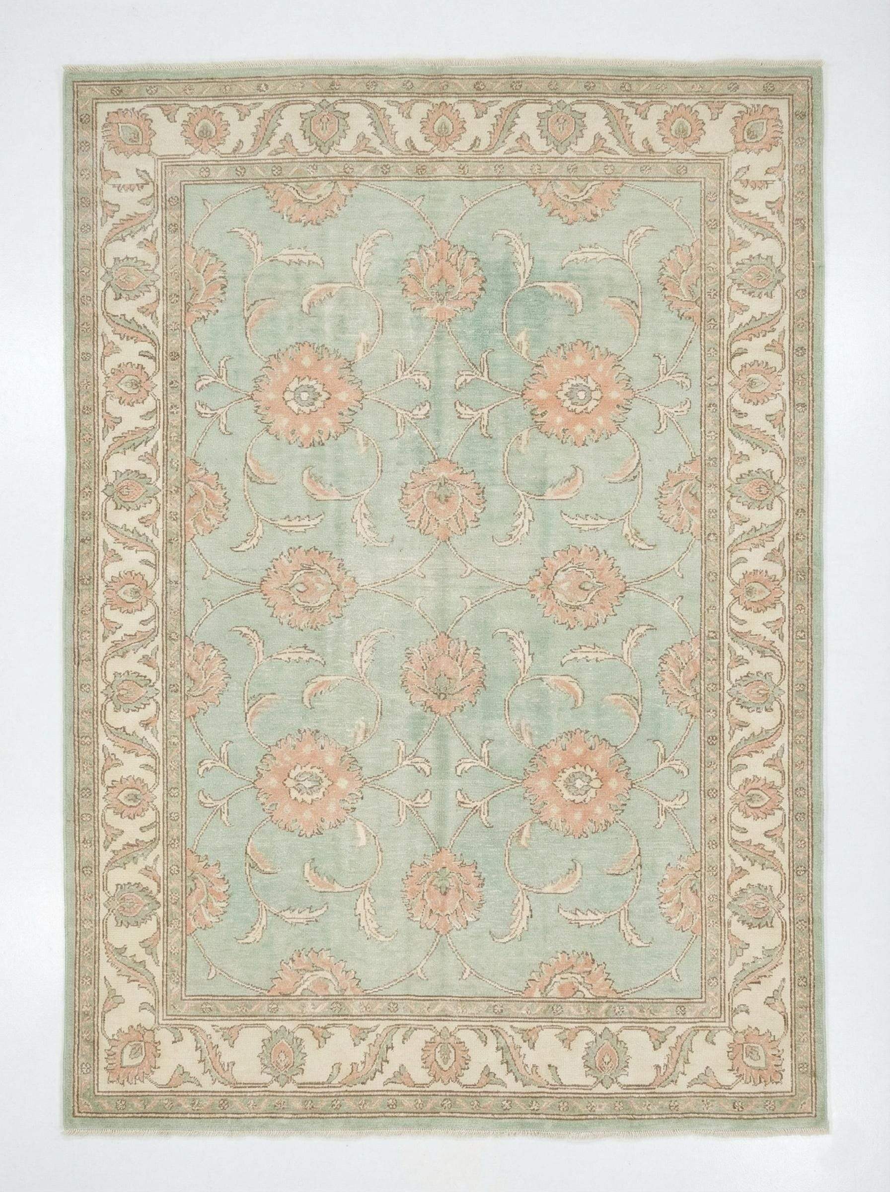 Hand knotted sage green Oushak wool rug with floral Turkish design