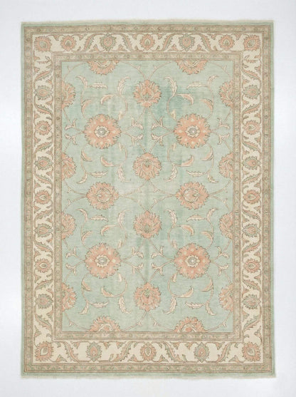 Hand knotted sage green Oushak wool rug with floral Turkish design