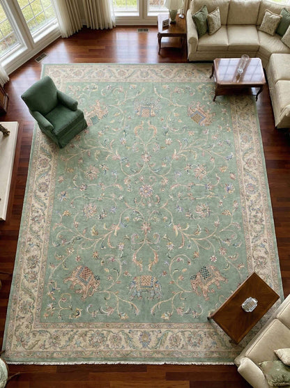 Sage green Persian wool area rug with hand-knotted floral and elephant motifs