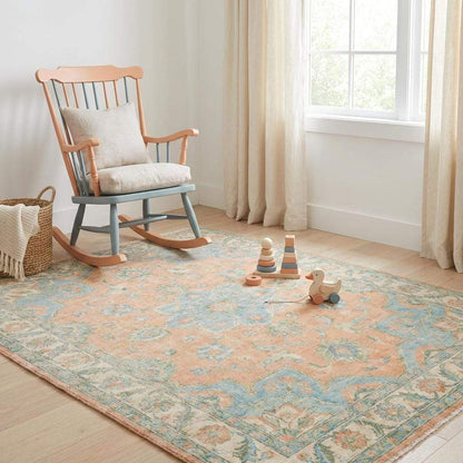 Elegant peach and blue wool rug suitable for bedroom or living room décor