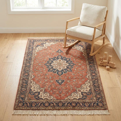 Wide shot of a bright living room featuring a large red traditional rug, showing how the medallion centers the furniture arrangement.
