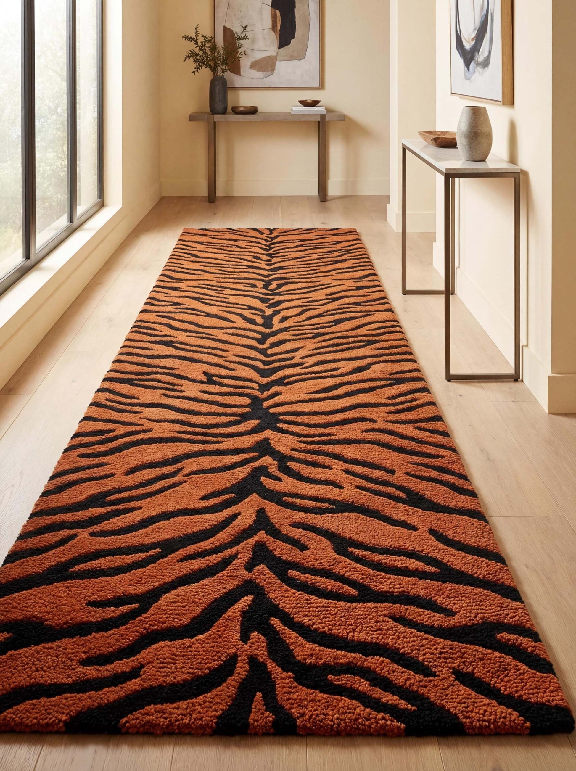 Hand tufted tiger print runner rug in burnt orange and black animal stripe pattern placed in a modern hallway interior __etsy:7851944939
