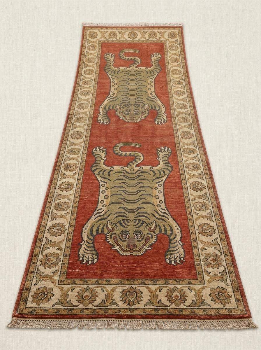 Traditional Tibetan tiger wool runner carpet with bold animal artwork, rust red field, and ivory floral border for hallway décor. __etsy:8100396218