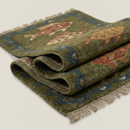 Tribal fish hand-knotted wool runner rug with geometric pattern and earthy tones