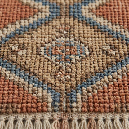 Close-up of hand knotted wool pile showing individual knot structure and natural fiber texture