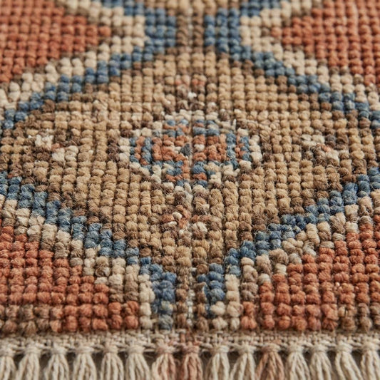 Close-up of hand knotted wool pile showing individual knot structure and natural fiber texture