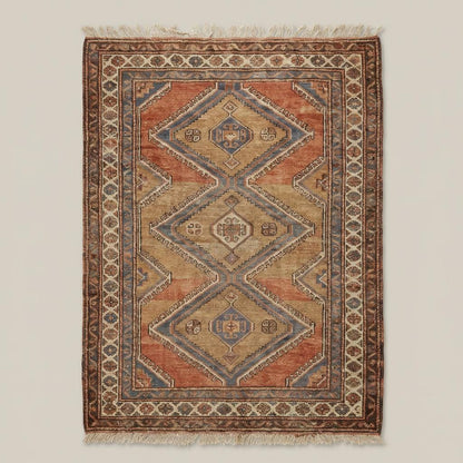 Rust and beige tribal geometric hand knotted rug styled in living room