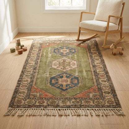 Tribal hand knotted wool rug with geometric Oushak medallion design in earthy olive green and rust tones
