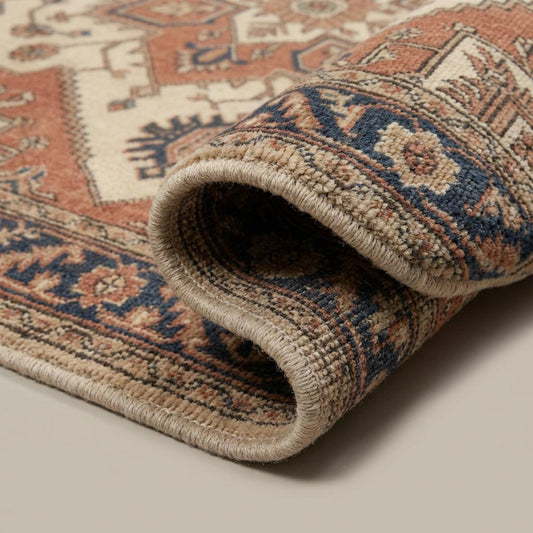 Close-up of hand knotted wool rug showing dense pile, individual knots, and natural wool fiber texture