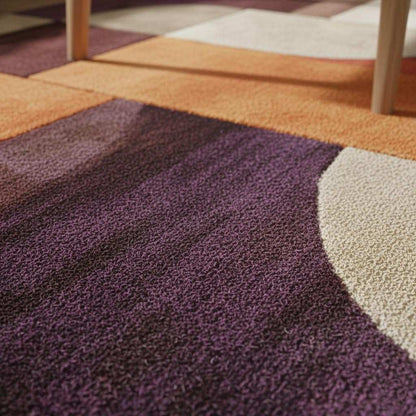 Colorful retro area rug with mid-century modern geometric pattern and plush texture