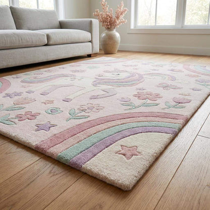 Corner detail of pastel nursery rug showing clean edges, soft pile height, and carved unicorn and rainbow design elements