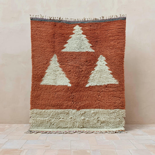 Vintage Berber wool rug with terracotta rust base and cream geometric triangle design