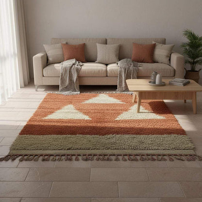 Wool area rug handmade Morocco rust terracotta with cream triangle pattern, ideal boho gift for housewarming.