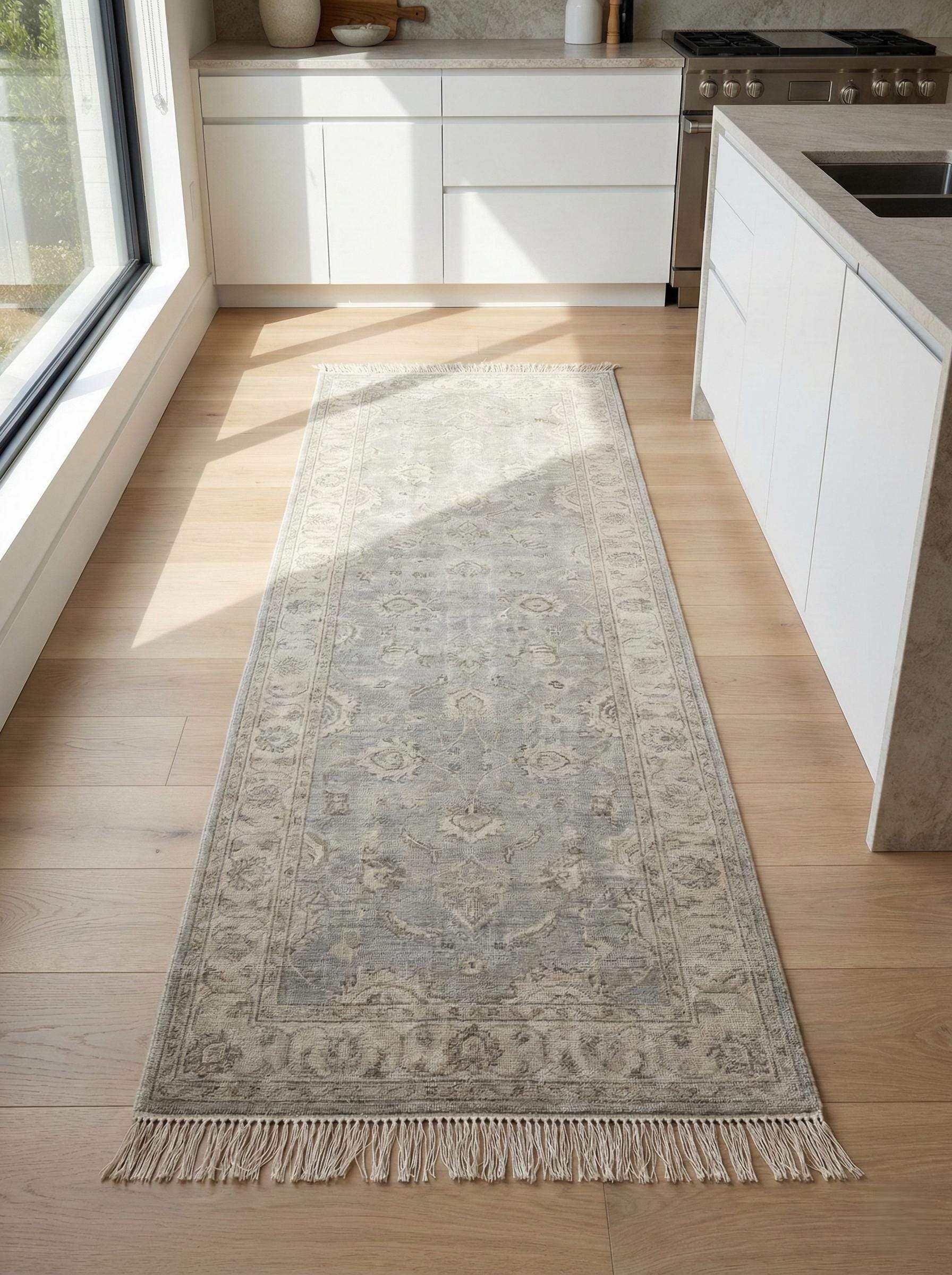 Vintage floral bordered hand-knotted runner rug in neutral gray with floral medallion pattern and hand-tied fringe edges