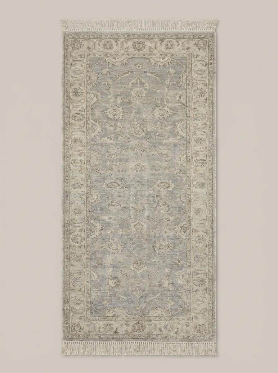 Vintage floral bordered hand knotted runner rug in neutral gray with floral medallion pattern and hand-tied fringe edges