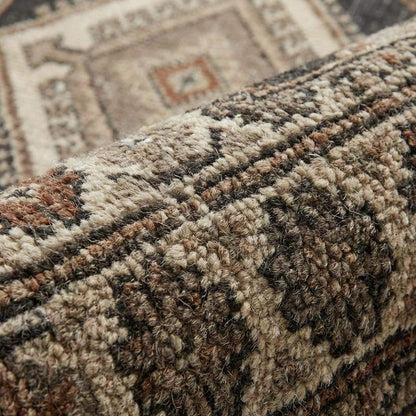 Close-up of hand knotted wool rug showing dense knot structure, natural wool fibers, and artisan craftsmanship