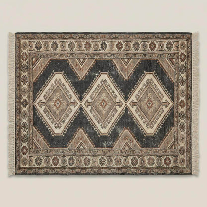 Rustic hand knotted tribal rug styled in farmhouse interior with stone flooring and wood beams