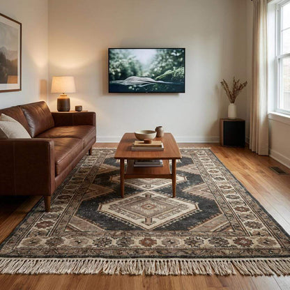 Artisan made wool rug featuring traditional tribal motifs and natural dye variation