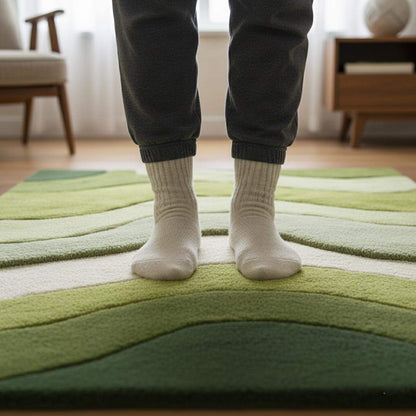 Wave pattern moss rug with green and cream tufted design resembling rolling hills