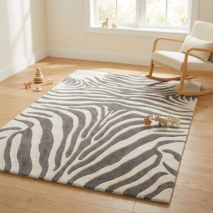Plush wool hand tufted zebra rug designed for living room or bedroom décor with bold striped pattern.