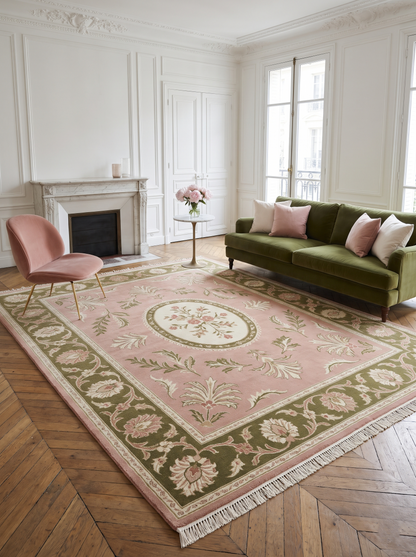 Pink Aubusson Rug in blush pink wool with an ivory floral medallion, olive green floral border and fringe