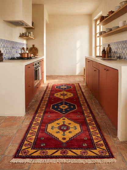 Red Tribal Runner Rug in wine red wool with gold and navy geometric medallions, floral border and fringe